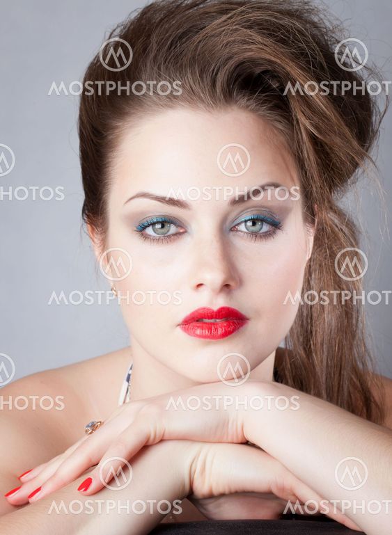 Portrait of young woman with big eyes