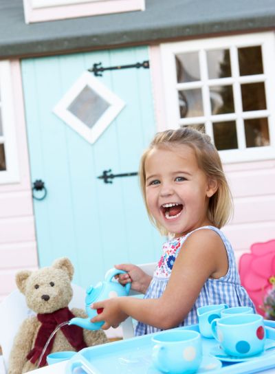 A young girl plays outdoors