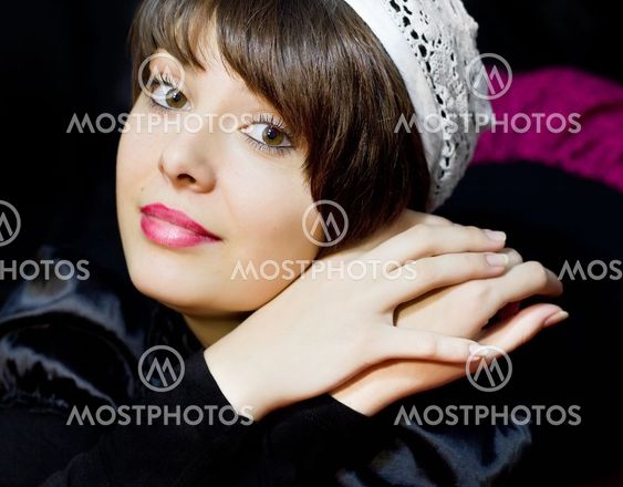 Beautiful brunette closeup in white hat
