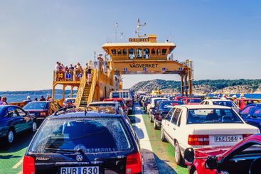 Cars on ferry on the swedish coast a summer day