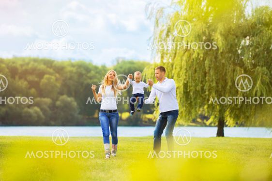 happy mother,father and son on a walk on Sunny day