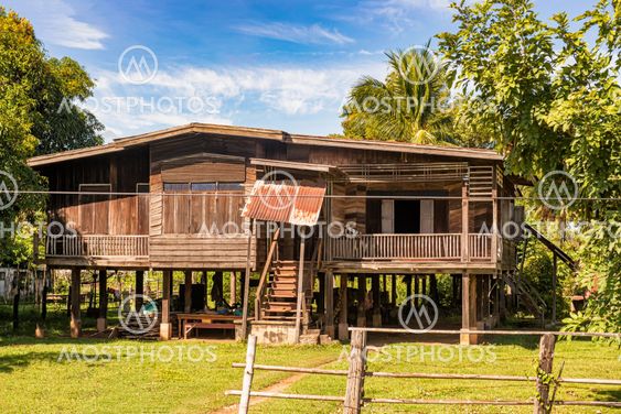 Typical house in the rural Laos at the bank of Mekong...