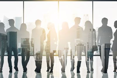 people silhouettes over window and city background