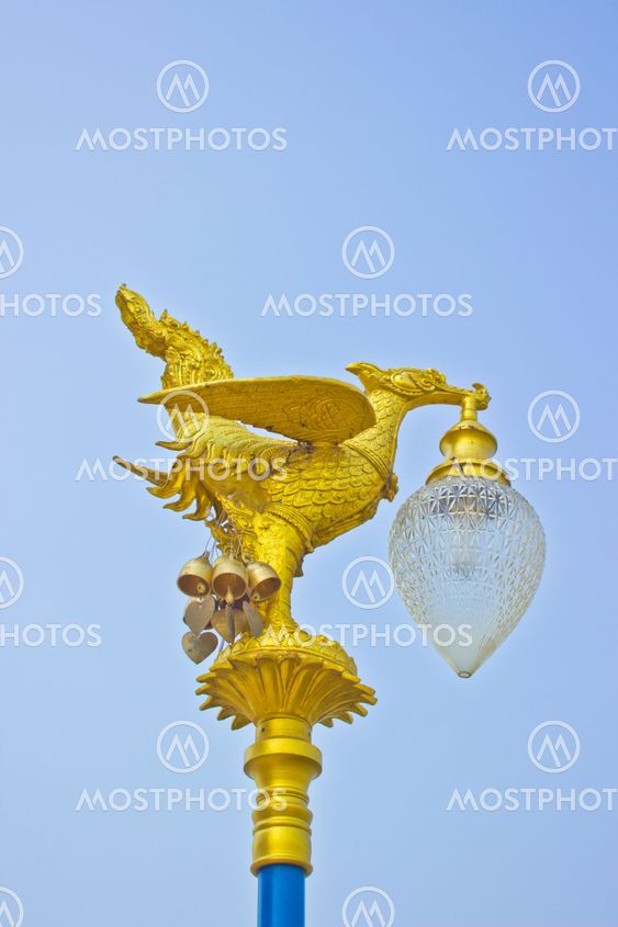 Golden swan lamp with blue sky