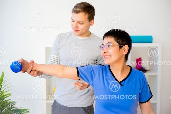 Physiotherapist working with patient