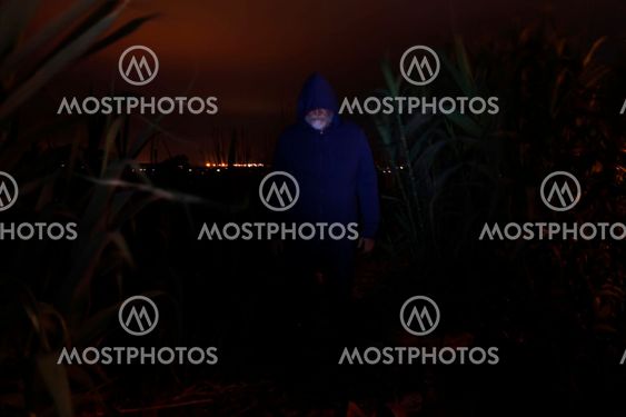 Hooded, Bearded Man in the Dark