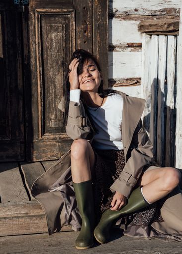 Beautiful fashionable brunette woman in gray coat on...