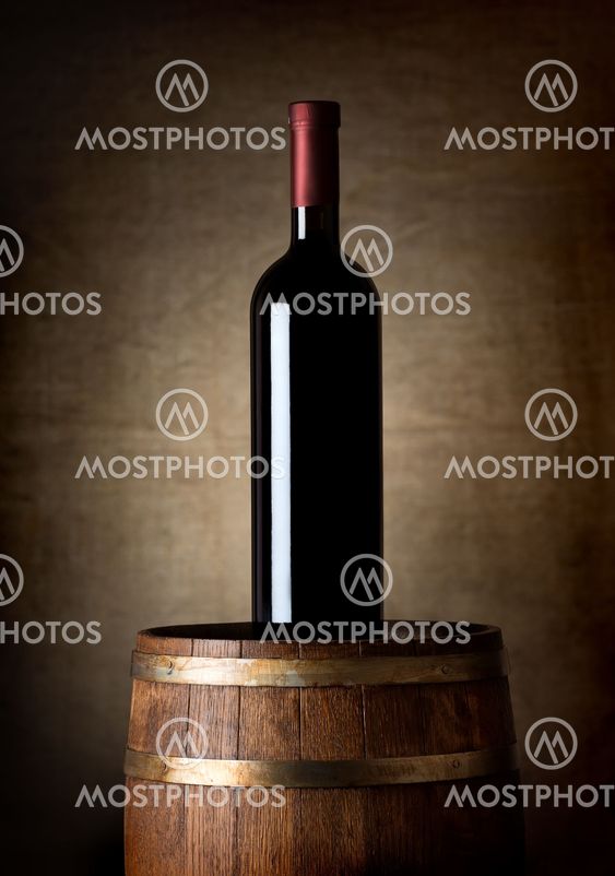 Bottle of wine on a barrel