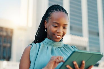 Search, tablet and business with black woman in city for...