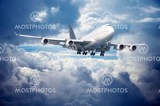 Aircraft is going for landing. Against cloudy sky