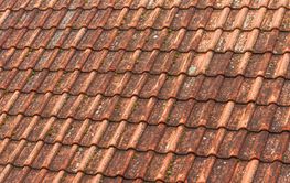 Old worn roof tile pattern as background