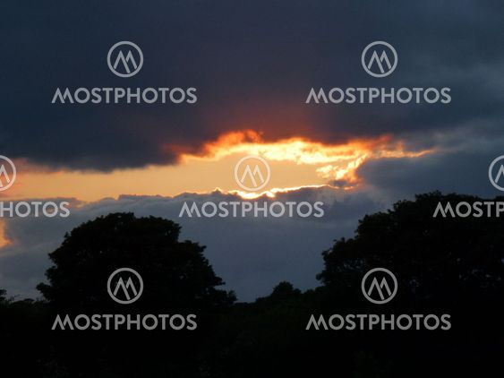 Sun breaking through clouds