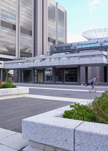 Skateboard, fitness and man in city, active and urban...