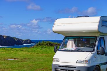 Camper on seashore, Asturias coast in Spain.