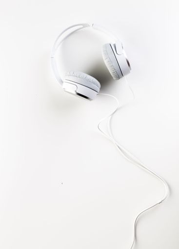 White headphones on white background close up