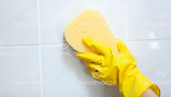 Close-up of a woman cleaning a bathroom