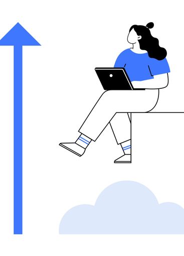 Woman working on laptop sitting on ledge with upward...