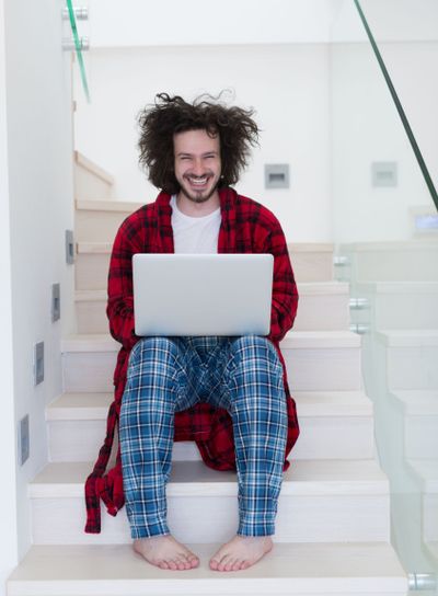 freelancer in bathrobe working from home