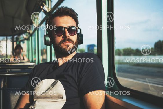 Young man riding in public transport