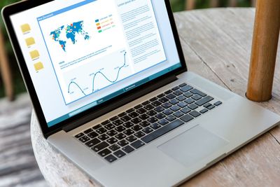 close up of laptop computer on table at hotel