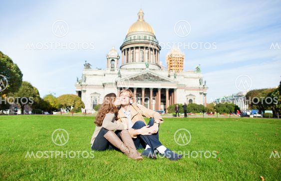 Happy couple kissing on a grass
