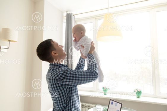 Young man throwing a baby