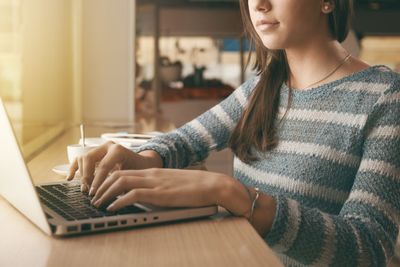 Busy woman using a laptop