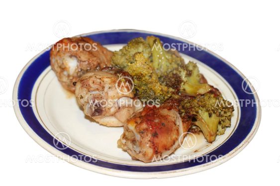 Fried chiken and cabbage broccoli on the plate