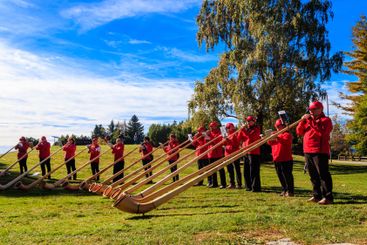 Traditional swiss alphorn players on Cardada, Switzerland