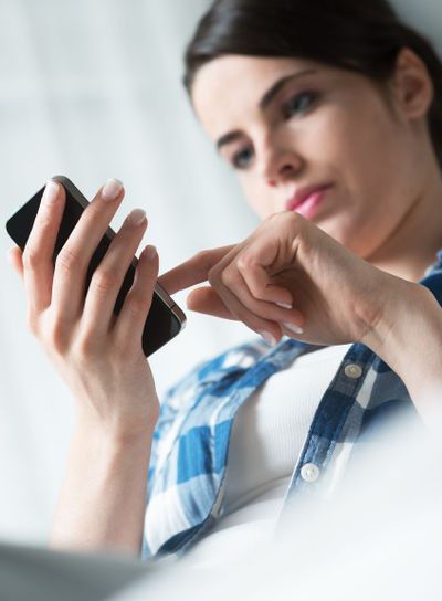 Woman texting on mobile phone