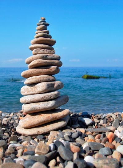 Balanced stones on the seashore summertime
