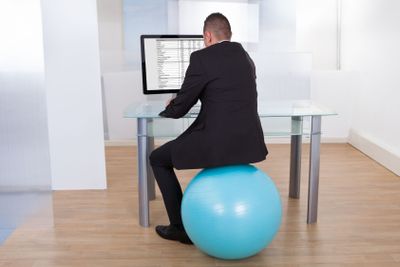 Businessman Using Computer In Office