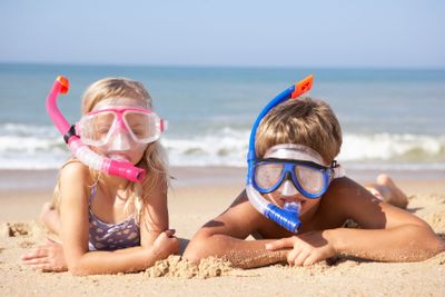 Young children on beach holiday