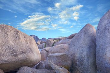 Outdoor, sandy and beach by clouds with rocks, scenic...