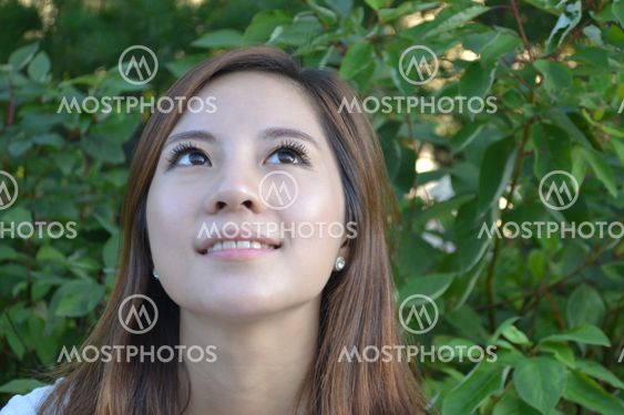 Beautiful young asian woman thinking