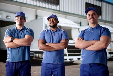 Cheerful truck drivers flashing big smiles