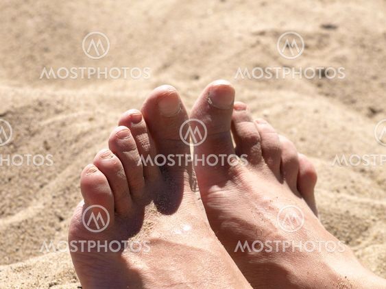 Female foots on beach