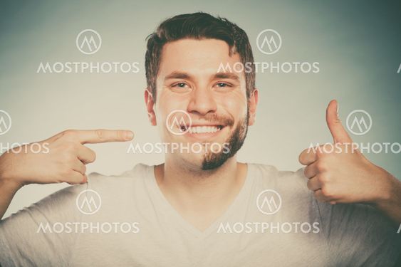 Happy man with half shaved face beard hair.