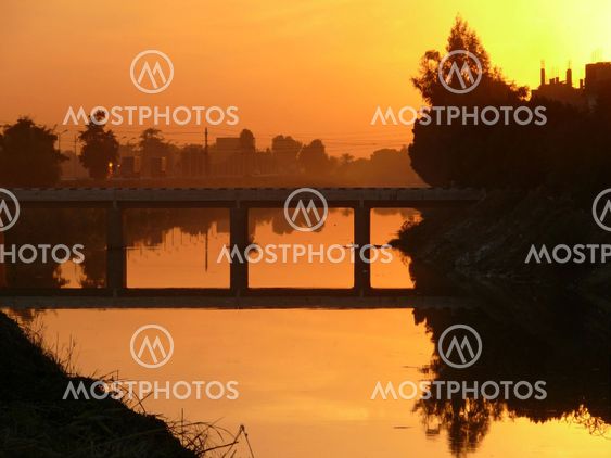 Bridge over the canal at sunset near Luxor.