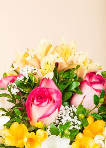 Colorful bouquet of pink roses and yellow flowers...