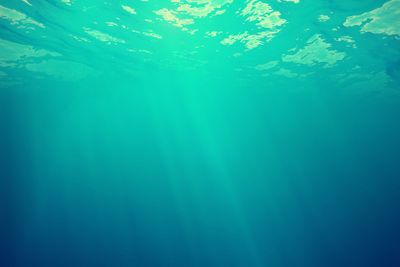 Underwater view of the sea surface with light rays. 3d...