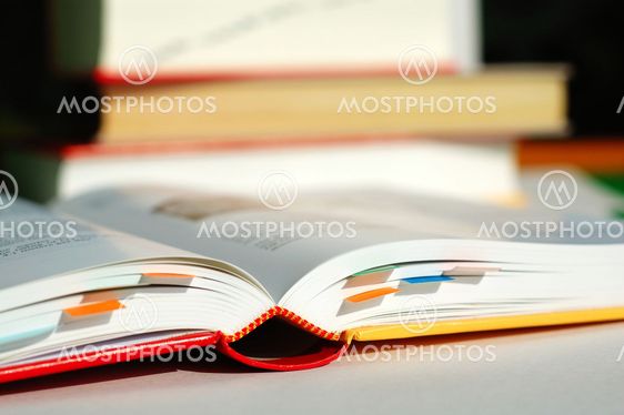 Reading book with bookmarks