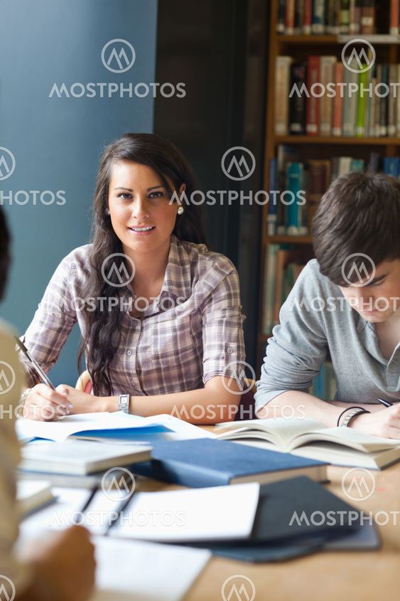 Portrait of young adults studying