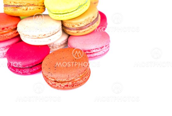 French colorful macarons on white background