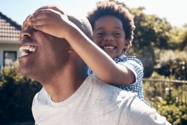 Piggyback, backyard and dad with child for playing,...