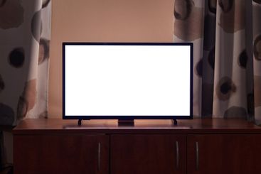 TV in a dim living room, blank screen