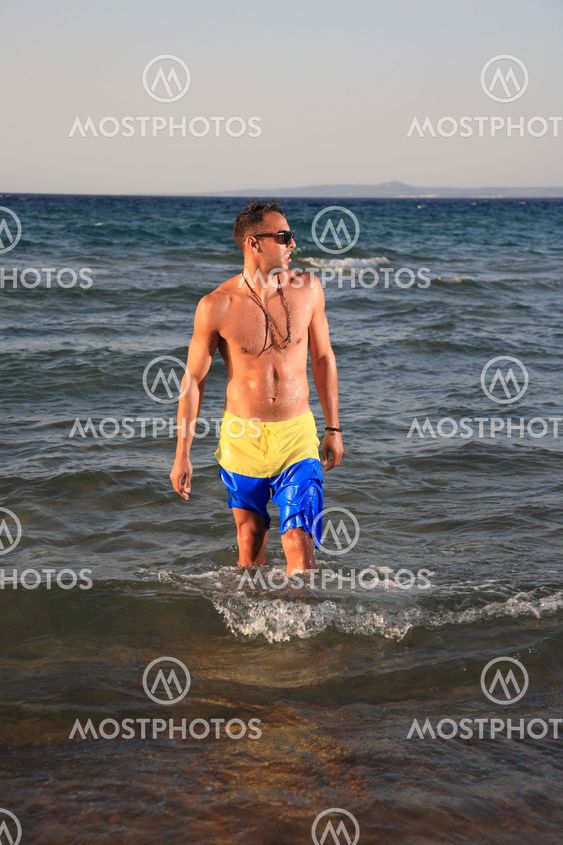 young man relaxing on the beach