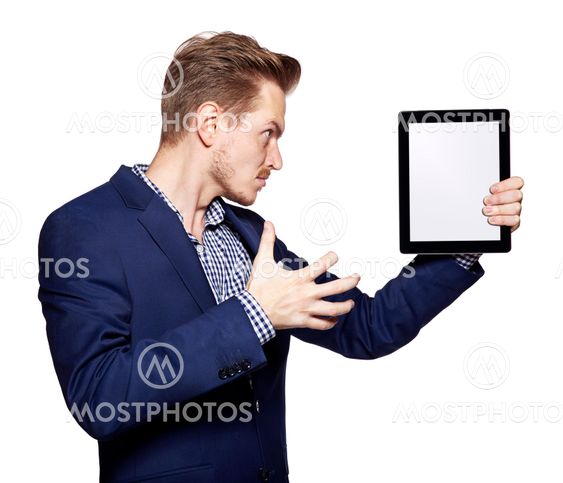 Angry young man and tablet PC
