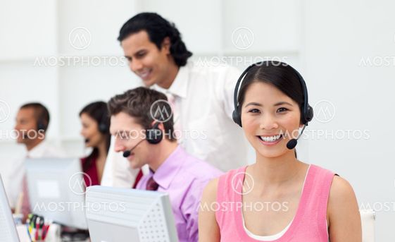 Ethnic manager checking his employee's work