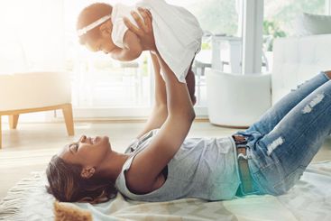 Happy woman, baby and lifting for childhood development,...